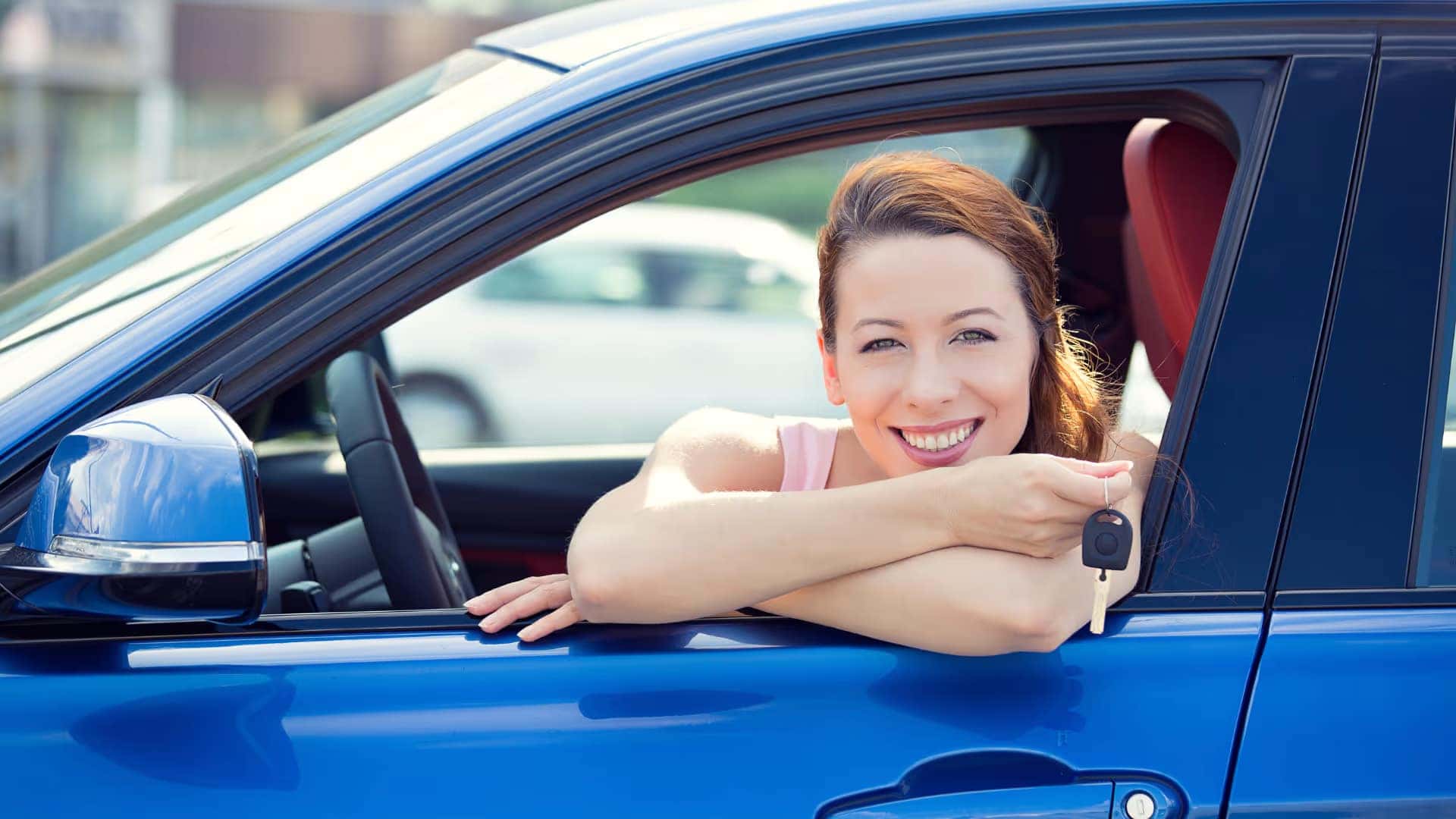 happy lady in blue car she bought from Tate Branch