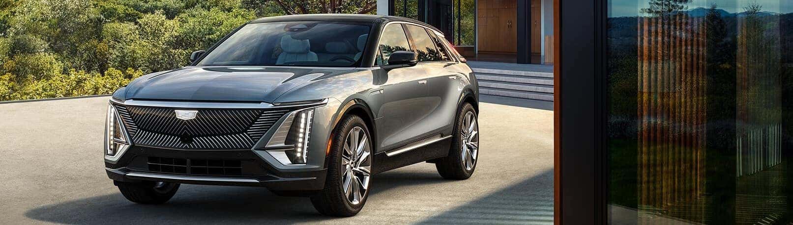 2023 Cadillac Lyriq in silver in front of a building.