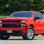 2021 Chevy Silverado parked in front of a field.