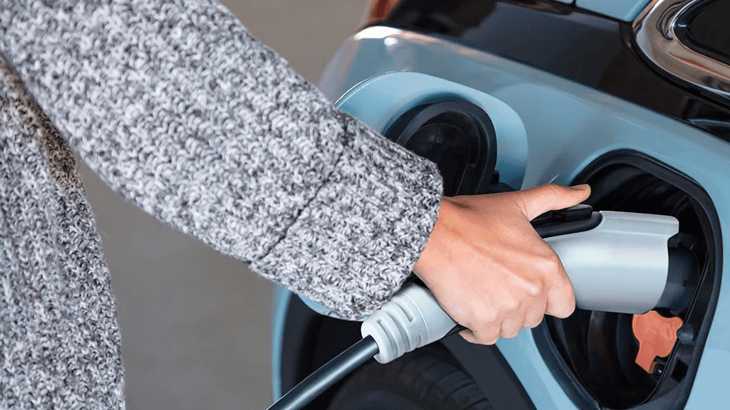 Close up of a 120-volt portable charging cord plugged into a 2022 Chevy Bolt EV.