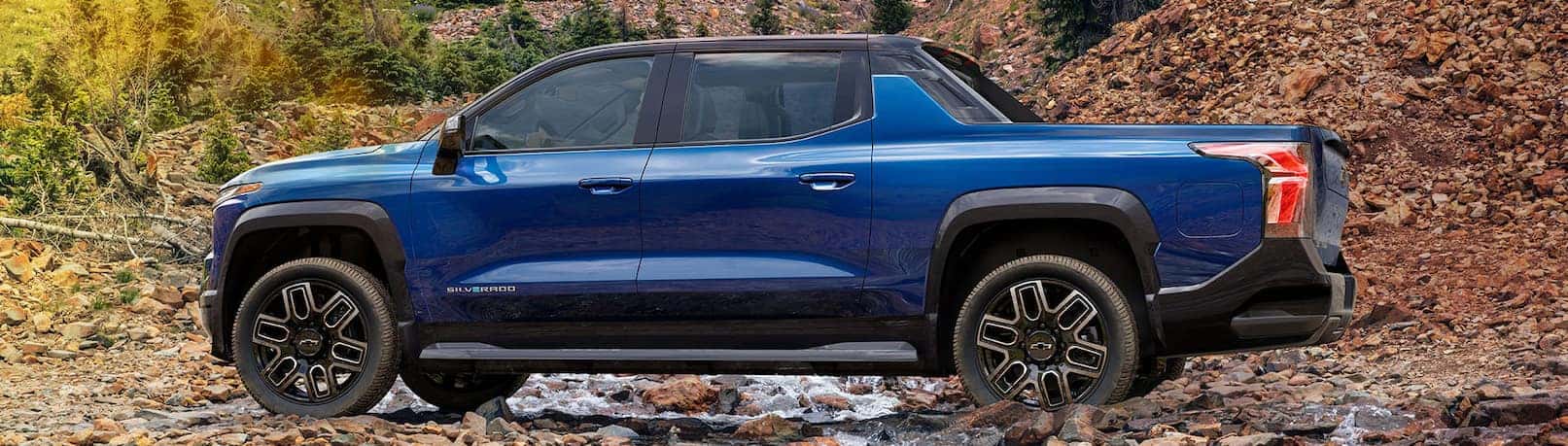 2024 Chevrolet Silverado EV parked in front of a building.