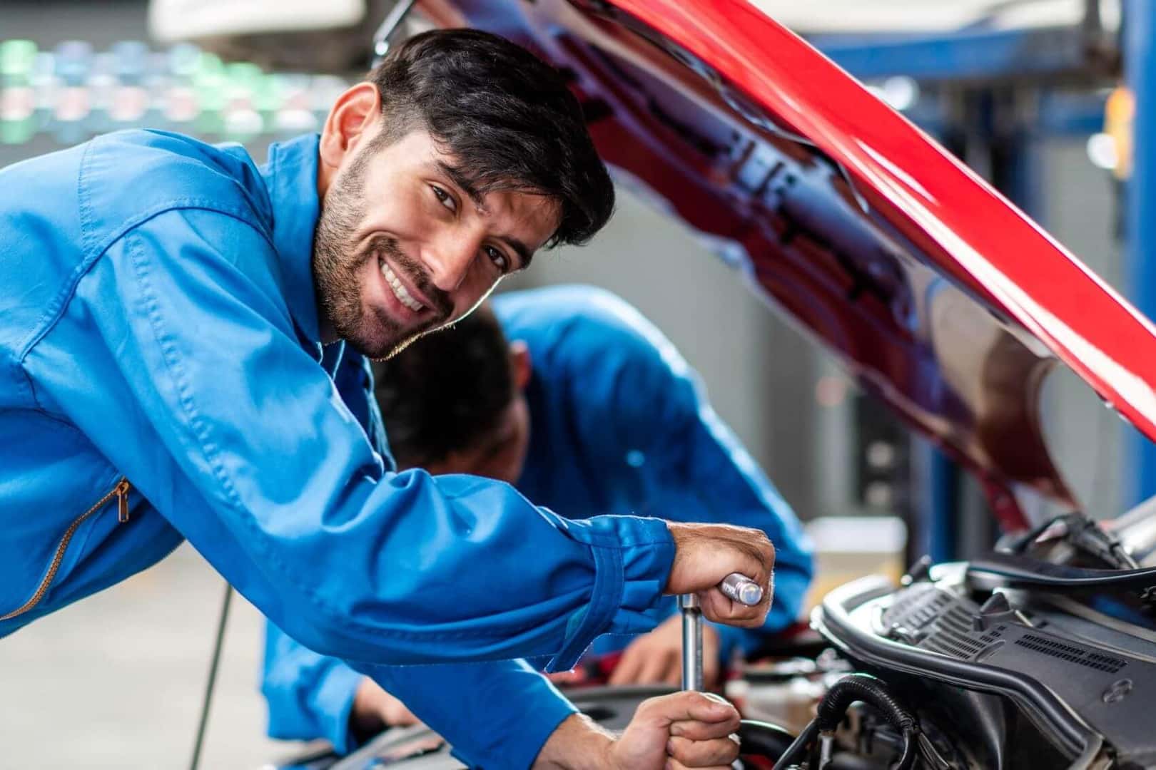 Mechanic underneath hood