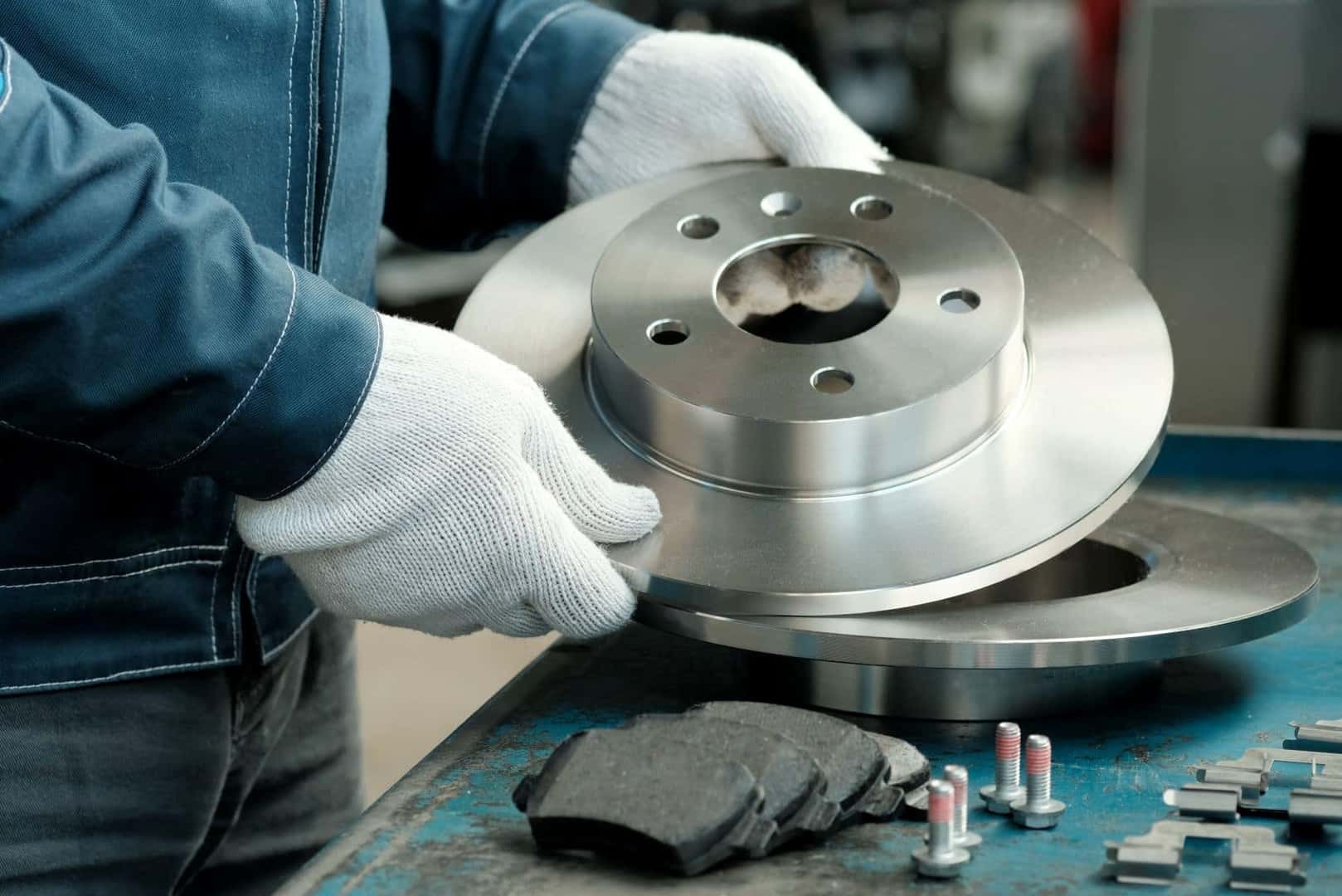 Mechanic handling a brake pad