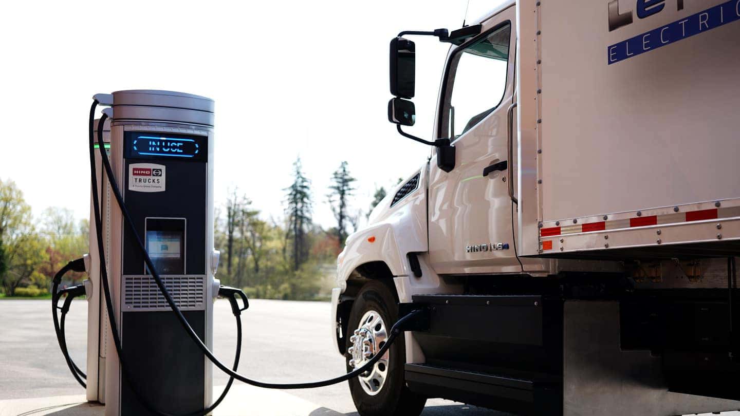 A zero-emission truck at a charging station.