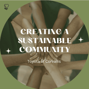 "Creating a sustainable community Toyota of Corvallis" is written on top of a photograph of a circle of hands and a green boarder. The image showcases a diversity of people
