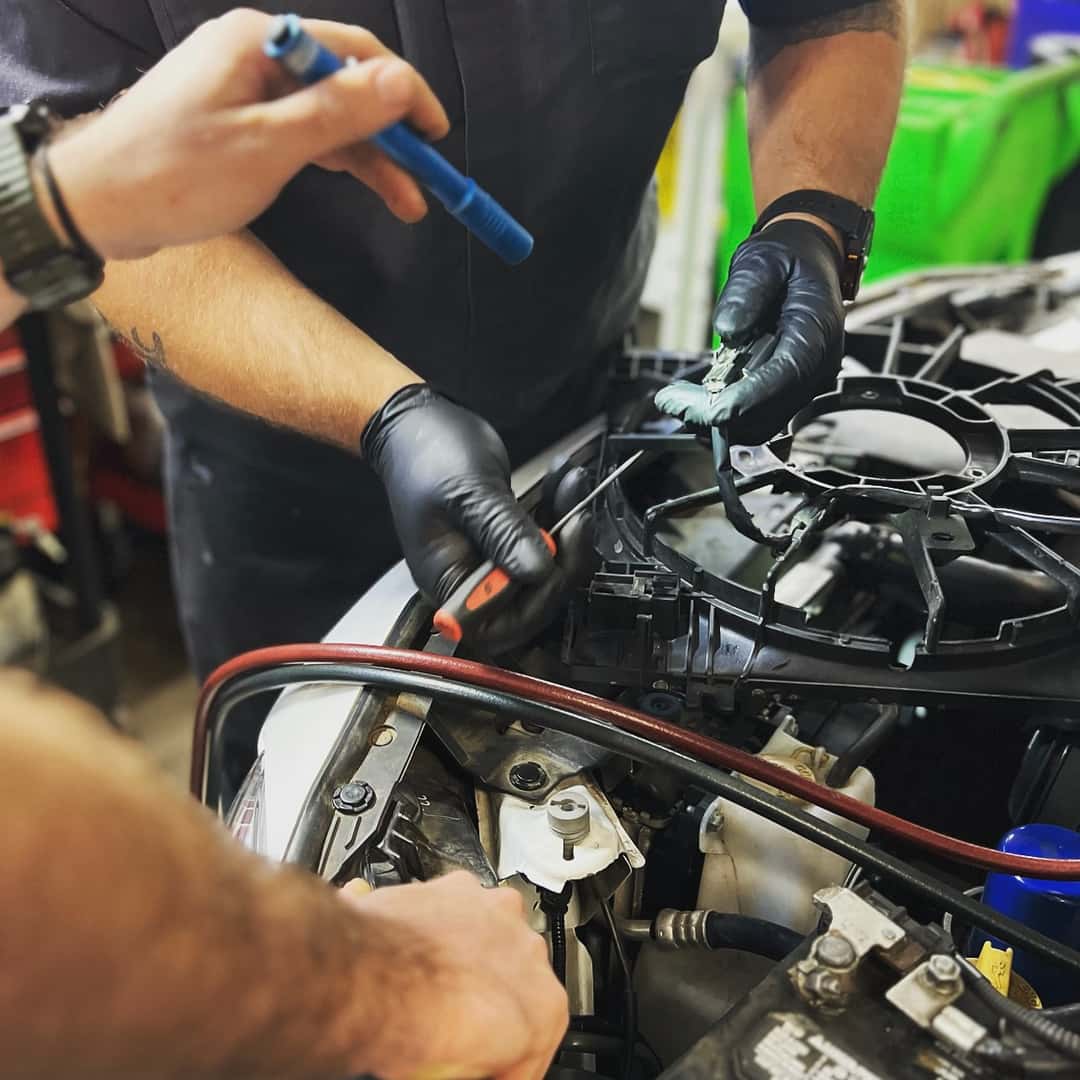 Service Technicians working on a car at Toyota of Corvallis
