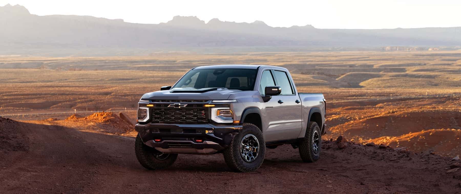 The all-new 2027 Chevrolet Silverado 1500 pickup driving on a dirt road
