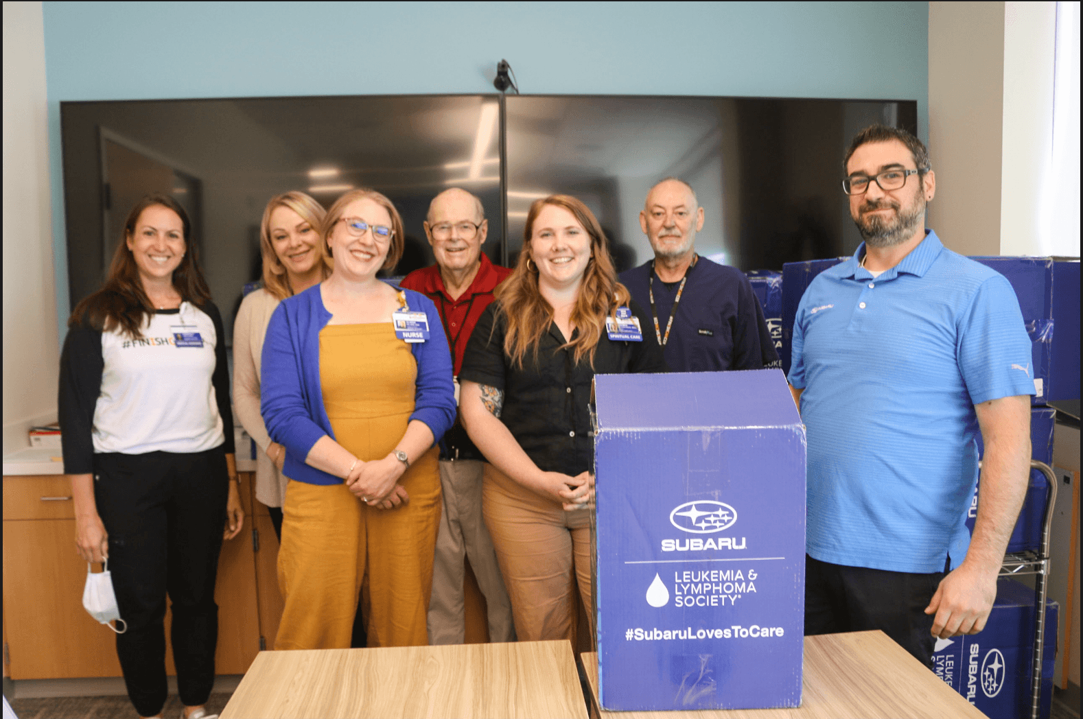 Providence cancer institute staff with wilsonville subarus richard spence and seth breimen 