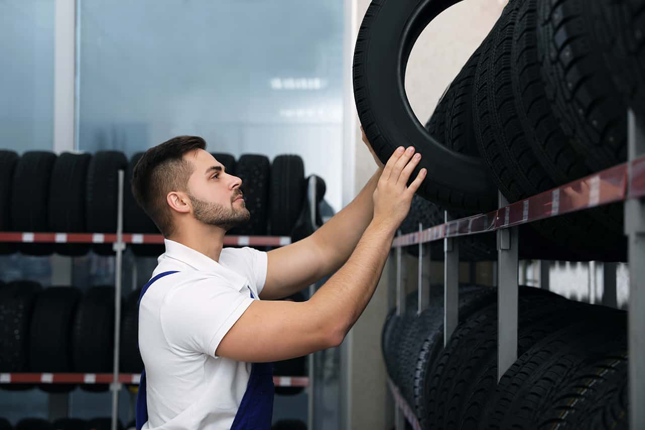 Technician installing new Lexus tires