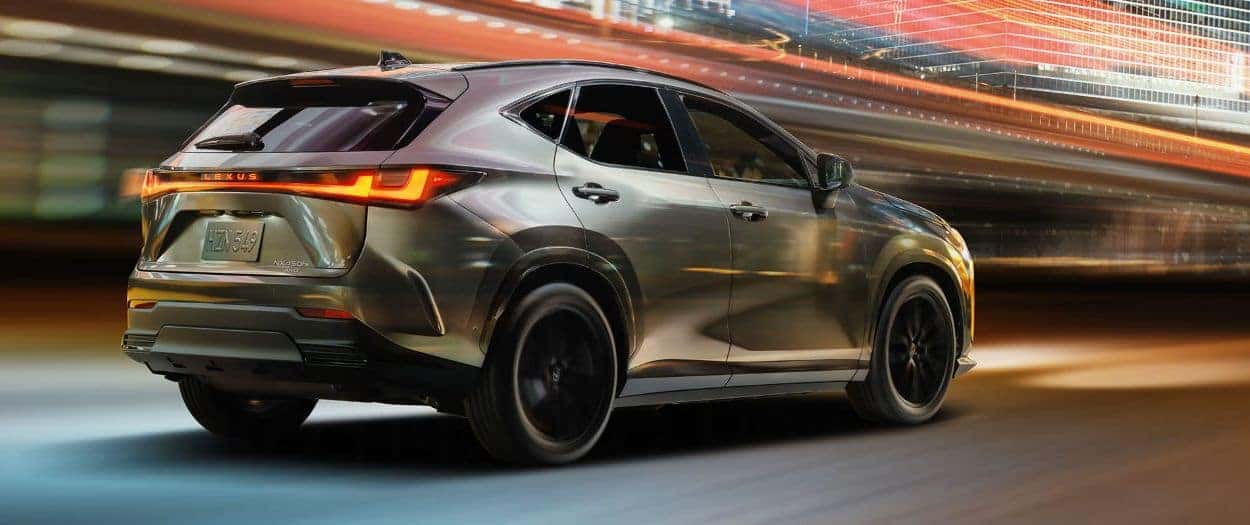 Gray 2026 Lexus NX driving with strong motion blur in blackground